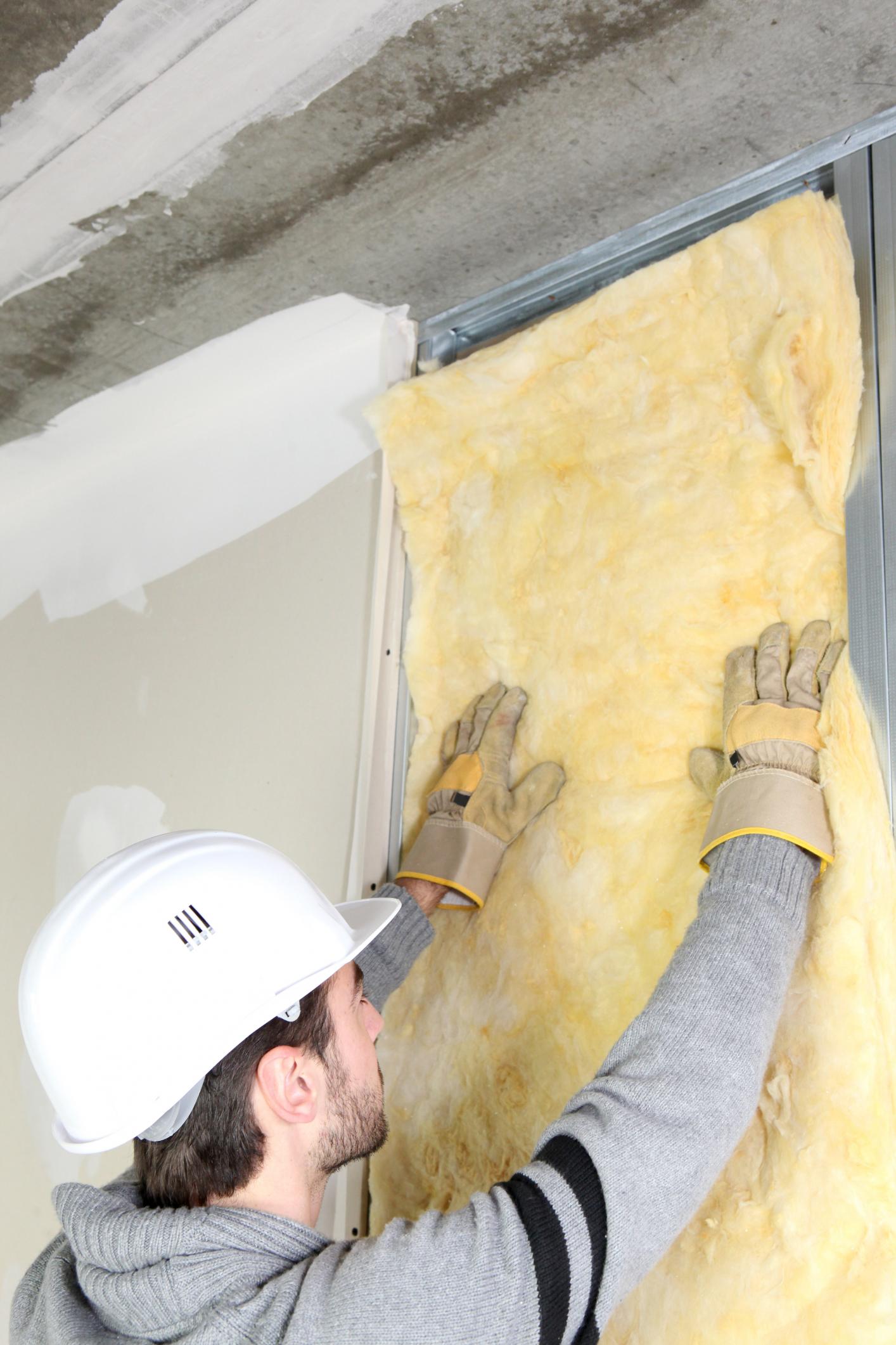 man-installing-insulation
