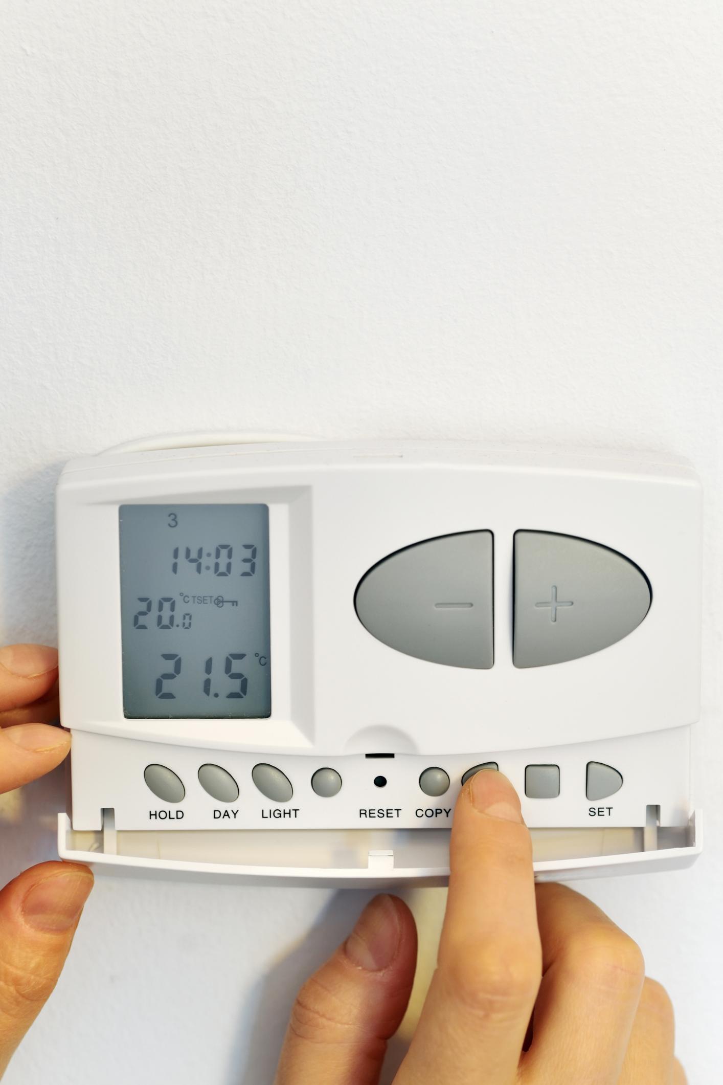 hand and thermostat